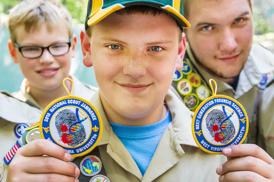 child holding scout patches